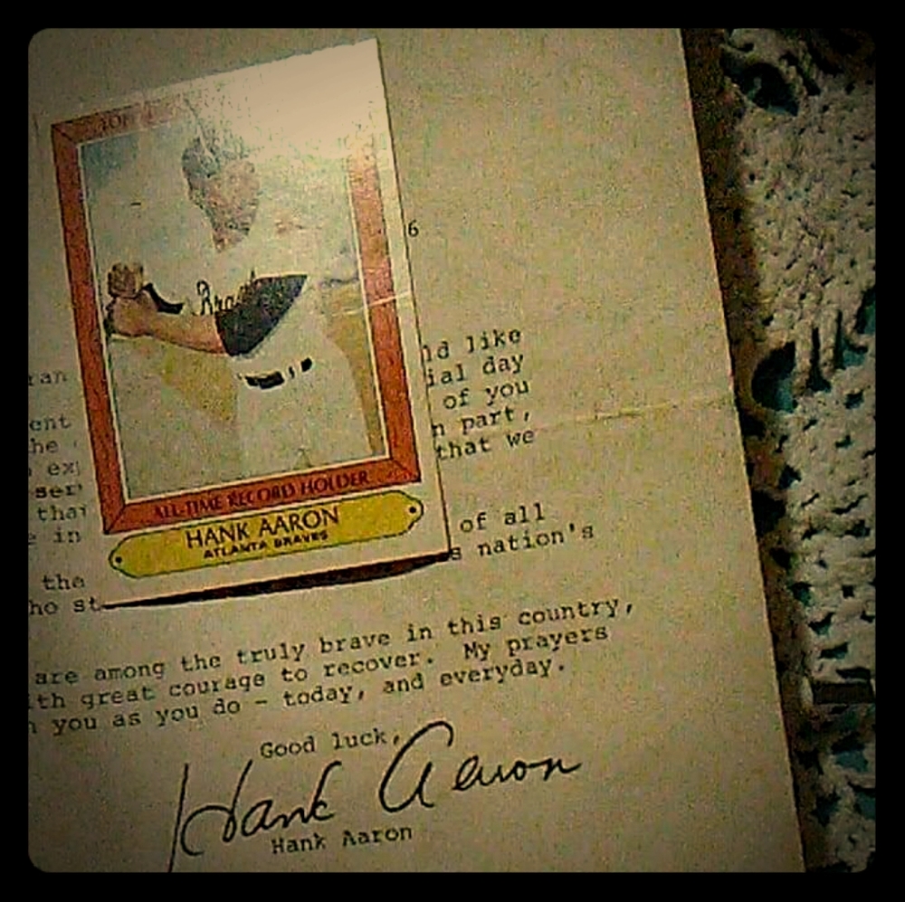 Hank Aaron autographed paper with baseball card